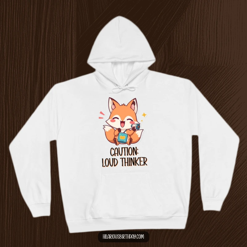 Funny hoodie featuring a playful fox character enthusiastically shaking a noisemaker, offering comfort and a burst of festive energy.