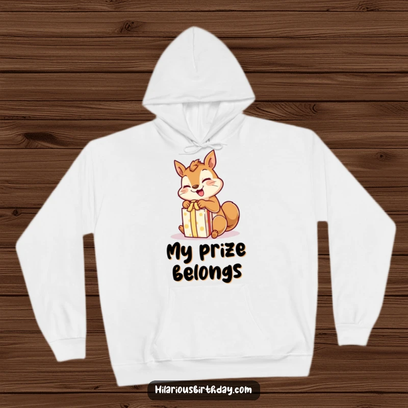 Funny giggling squirrel character excitedly unwrapping a gift, featured on a warm, comfortable hoodie.