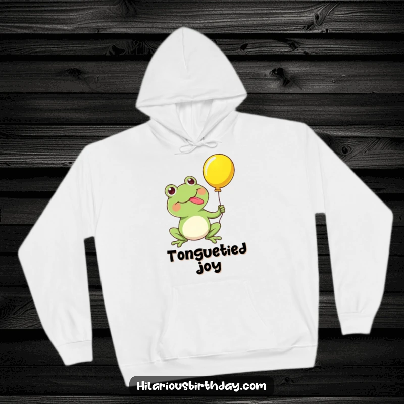 Funny hoodie featuring a kawaii frog character happily popping a balloon with its tongue, providing warmth and a burst of comedic joy.