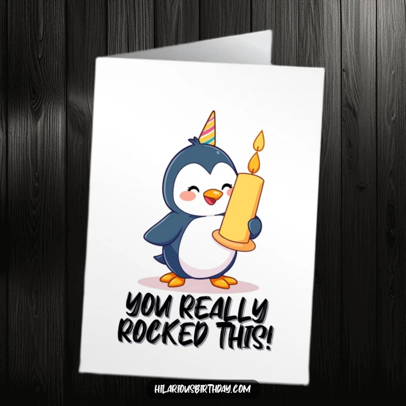 Funny Free Printable Congratulations Card: A happy penguin waddles with a giant birthday candle, celebrating success.