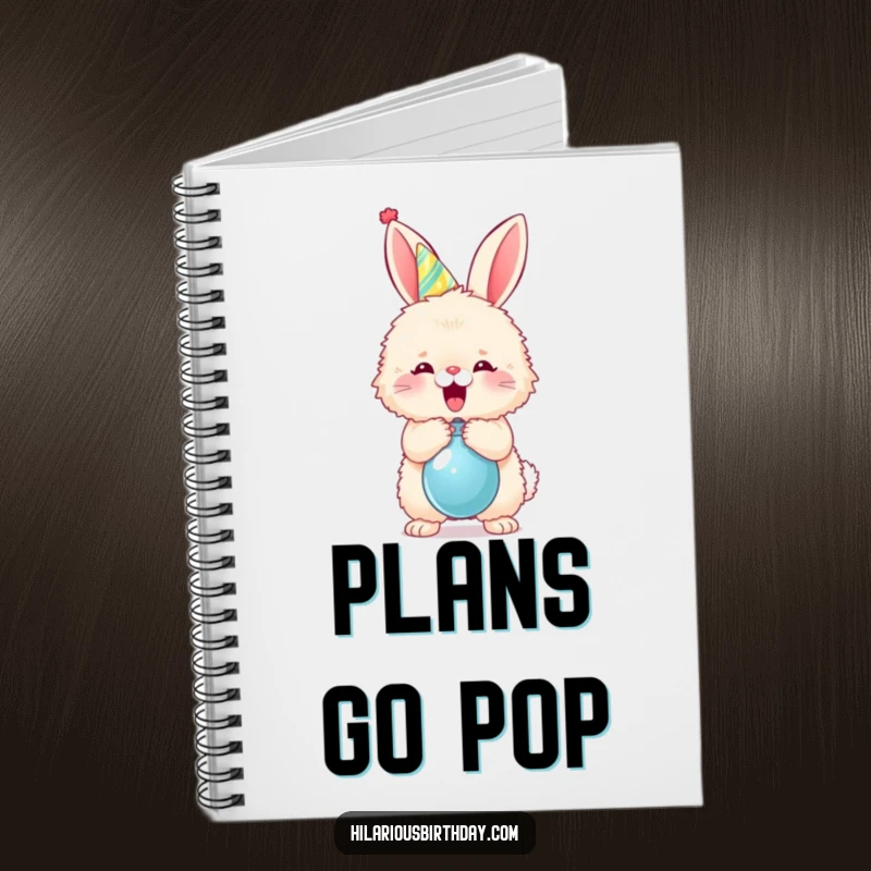 Funny fluffy bunny in a party hat popping a balloon on a notebook cover, for planning festive fun.