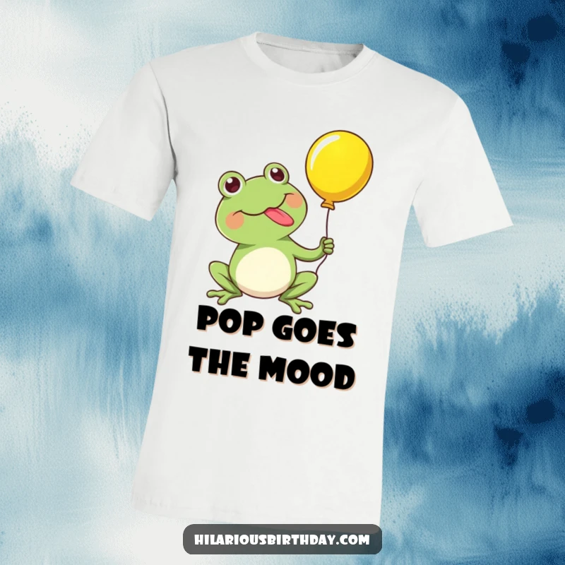Funny t-shirt featuring a kawaii frog character happily popping a balloon with its tongue, showcasing explosive and comical celebration.